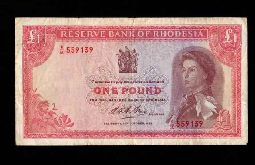 Front and back of a circulated 1968 Rhodesian 1 Pound banknote featuring Queen Elizabeth II and Victoria Falls.