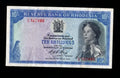 Front and back of a 1966 Rhodesian Ten Shillings banknote, Pick #27b, featuring Queen Elizabeth II and a tobacco field.