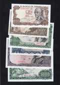 Actual photo of a collection of Spanish Peseta banknotes from 1965 to 1971, including 100, 500, and 1000 denominations in Uncirculated condition.