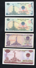 Front and back view of four Vietnamese banknotes: two 1 Dong notes, one 2 Dong note, and one 10 Dong note from 1985-1988.