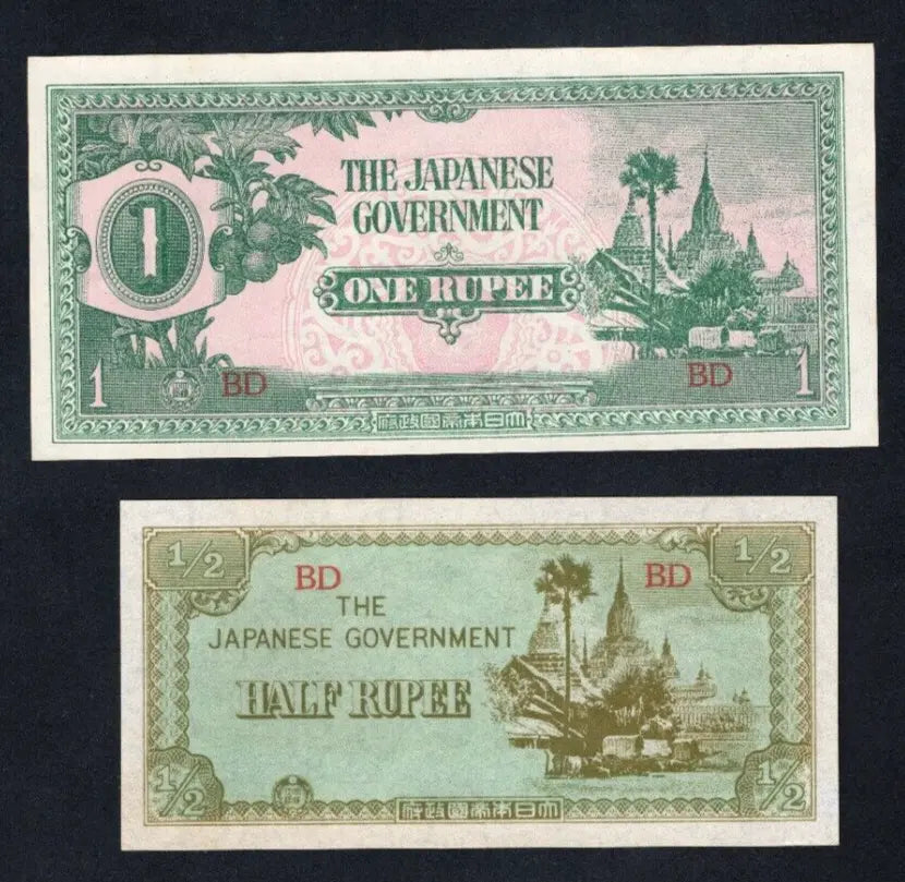 Stock photo of two 1942 Japanese occupation banknotes for Burma, showing the 1 Rupee and Half Rupee denominations.