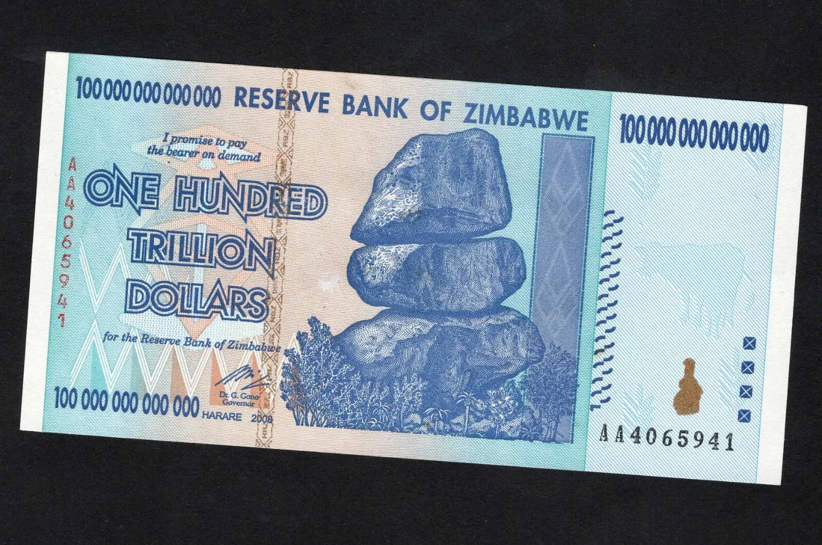 Front and back view of a 2008 Zimbabwe 100 Trillion Dollars banknote, Pick 91, featuring Balancing Rocks and Victoria Falls.
