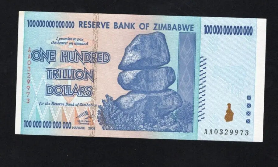 Front and back view of a circulated 2008 Zimbabwe 100 Trillion Dollar banknote showing Chiremba Balancing Rocks and Victoria Falls.