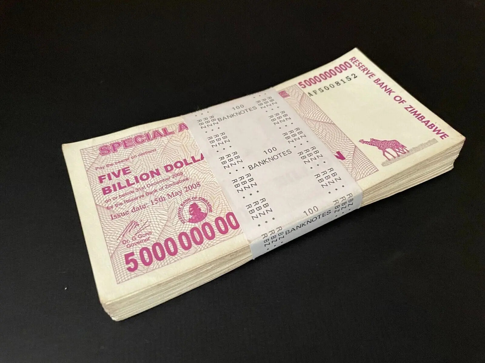 A bundle of 100 circulated 2008 Zimbabwe 5 Billion Dollars Special Agro-Cheques. Authentic used hyperinflation currency.